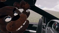 Freddy in a car