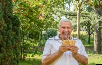 Old man showing euro