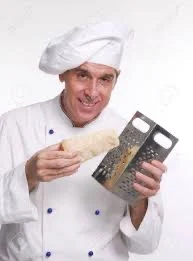 A guy grating cheese