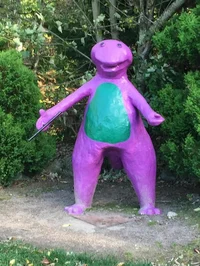 Cursed barney statue
