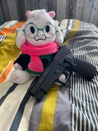 ralsei plush and gun