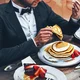guy eating pancakes